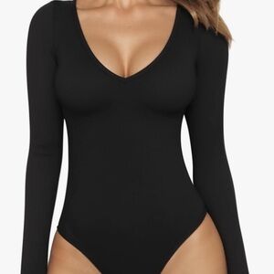 Black fitted bodysuit with plunge v-neck and long sleeves